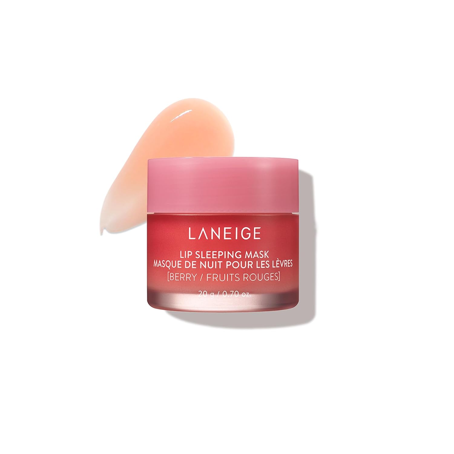 A pink jar of Laneige Lip Sleeping Mask in Berry flavor with a swatch of the glossy product next to it on a white background—perfect for scoring during Black Friday deals.