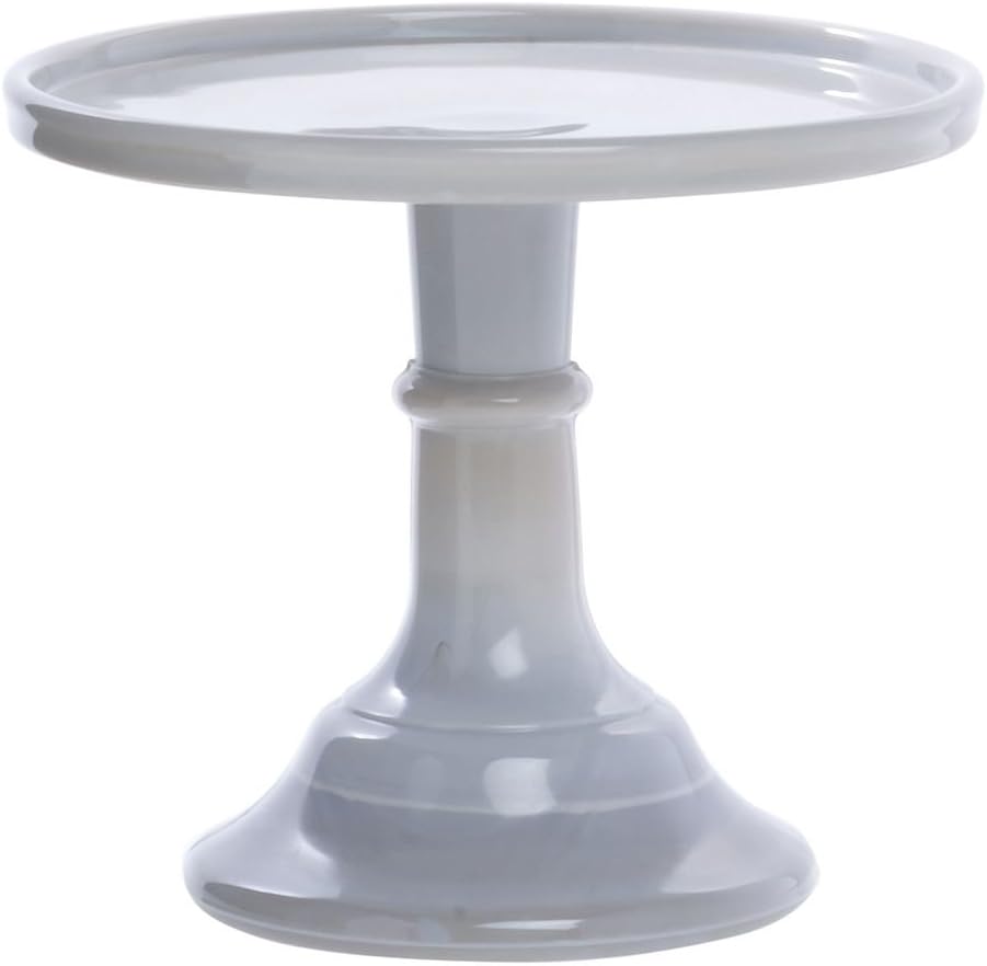 A gray ceramic cake stand with a round top and a pedestal base is perfect for displaying festive Christmas tree cupcakes.