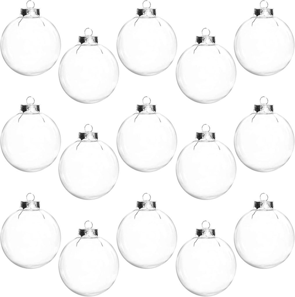 Fifteen clear glass Christmas ornaments arranged in a grid pattern on a plain white background.