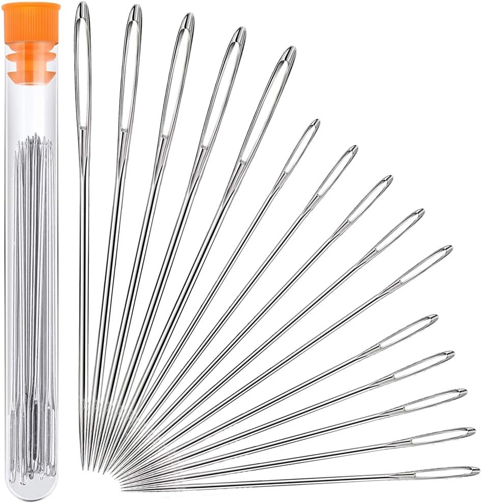 A set of 16 sewing needles, perfect for button crafts, arranged in a fanned-out pattern beside a transparent tube with an orange cap.