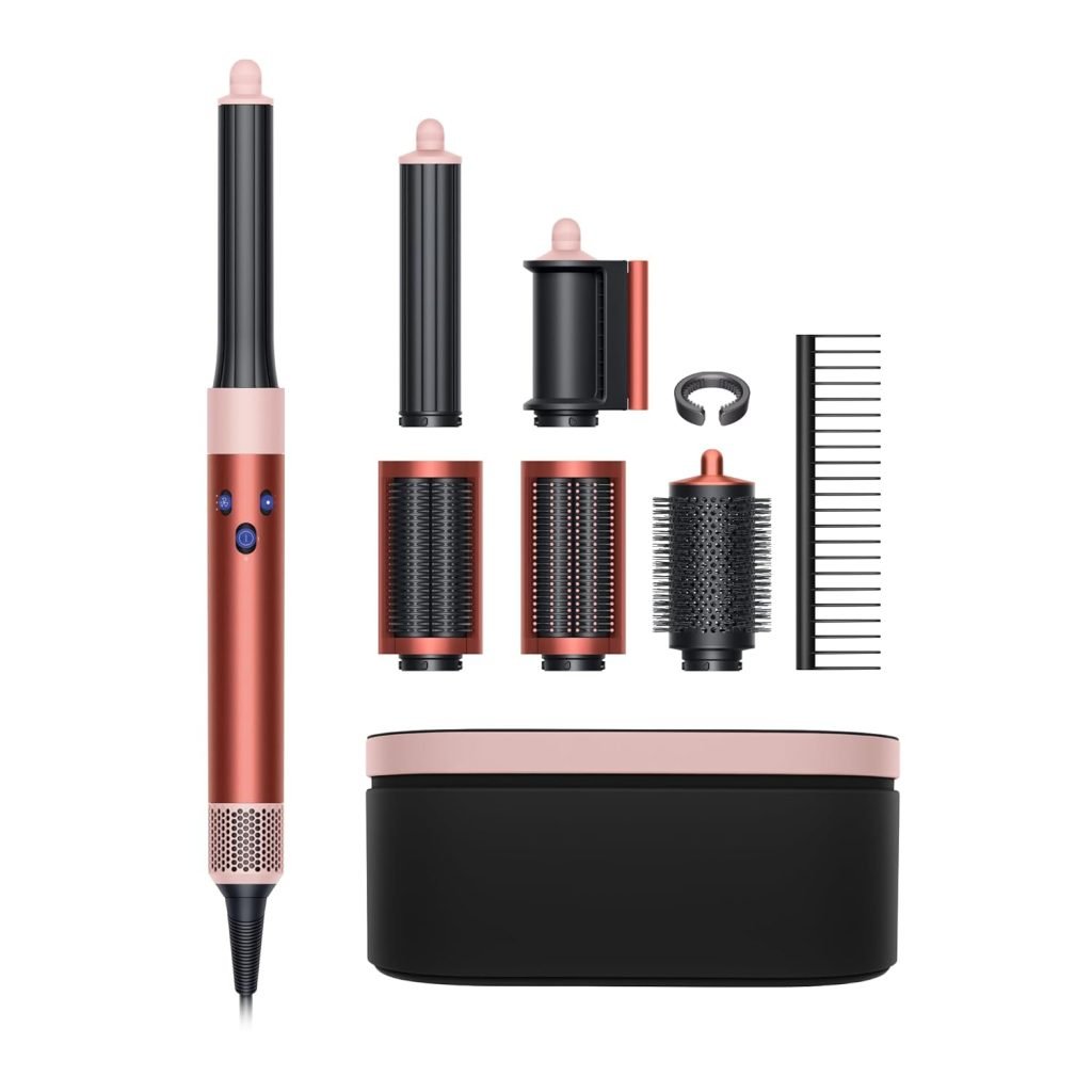 A versatile hair styling tool with multiple attachments and a comb, beautifully showcased beside a sleek black and pink storage case, perfect for grabbing on Black Friday deals.