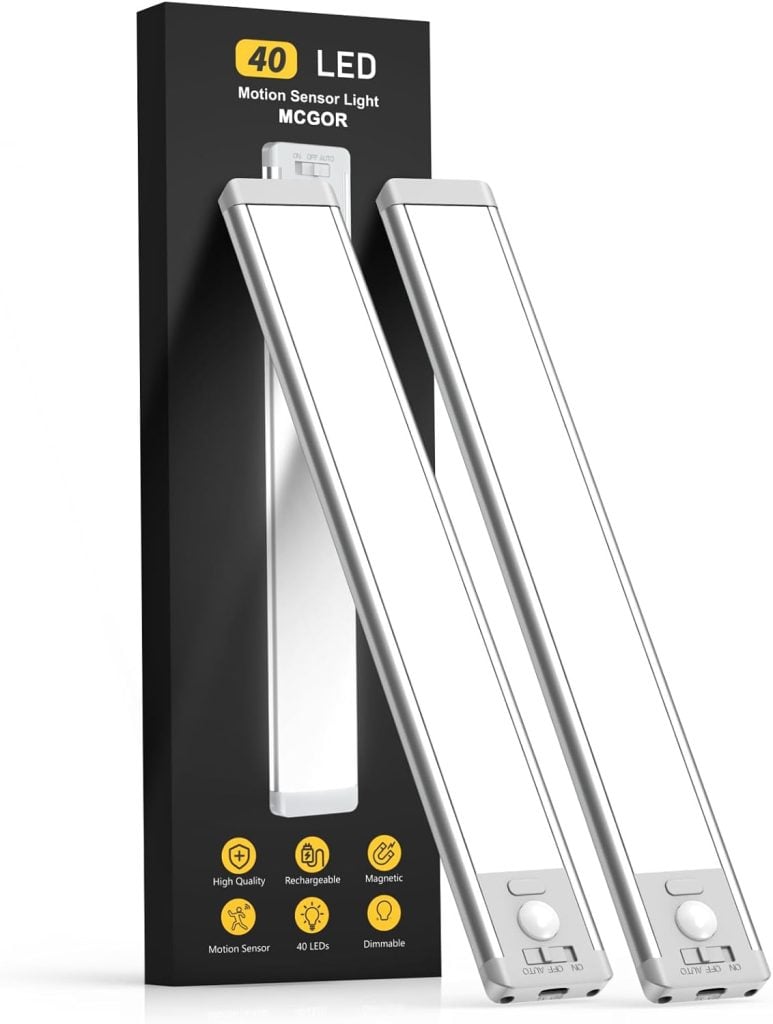 Two white motion sensor LED lights are showcased next to their sleek black packaging, which highlights their impressive features. Don't miss the upcoming Black Friday deals to snag these innovative lights at an unbeatable price!