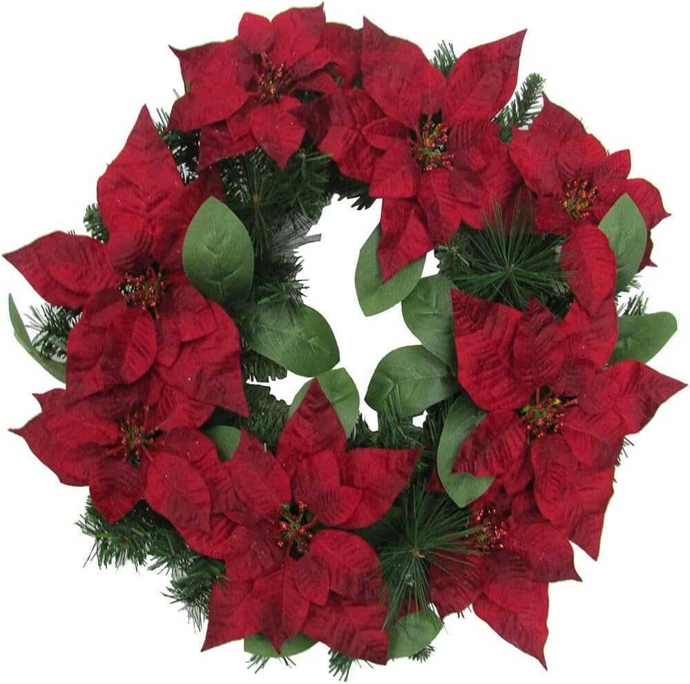 A beautiful Christmas wreath adorned with red poinsettia flowers and lush green leaves.