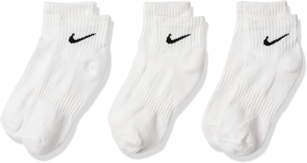Three pairs of white Nike ankle socks with black swoosh logos are displayed side by side on a white background, perfect for unwrapping on Christmas morning.