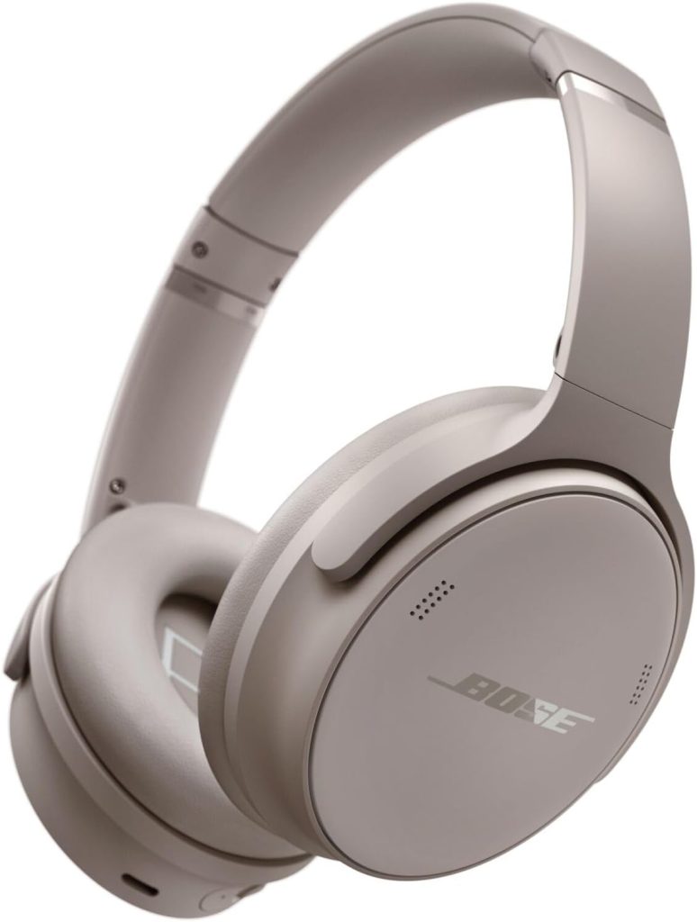 A pair of over-ear, wireless Bose headphones in a light beige color, featuring the Bose logo on the ear cup—perfect for upgrading your sound this Black Friday.