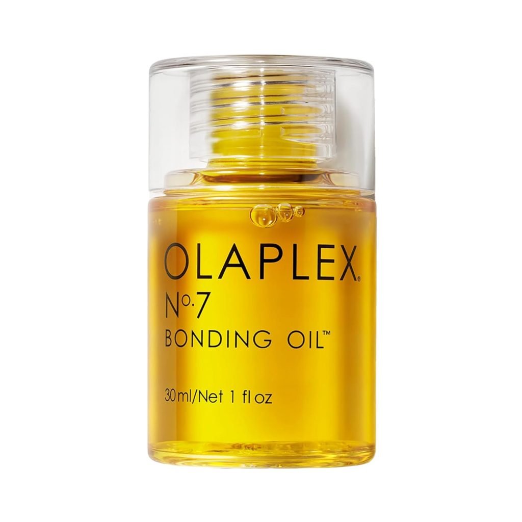 A small transparent bottle of Olaplex No. 7 Bonding Oil, containing 30ml of golden liquid, is shown with the label visible on the front, perfectly poised for Black Friday deals.