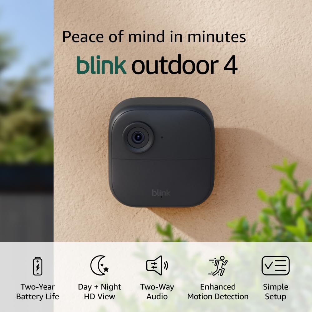 The Blink Outdoor 4 security camera, perfect for Black Friday deals, features a two-year battery life, HD view, two-way audio, enhanced motion detection, and simple setup. Secure your home effortlessly with this reliable device mounted on your wall.