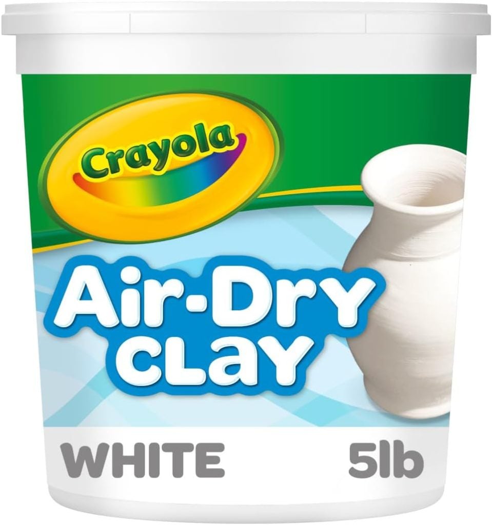 Container of Crayola Air-Dry Clay, white, 5 lb, with an image of a pottery vase on the label.