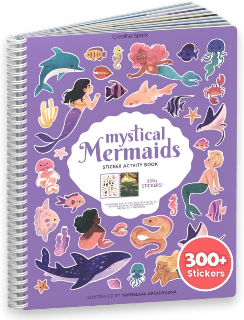 A spiral-bound "Mystical Mermaids Sticker Activity Book" with a purple cover, featuring cartoon mermaids, sea animals, and a label indicating over 300 stickers—perfect for bringing Christmas Morning magic to life.