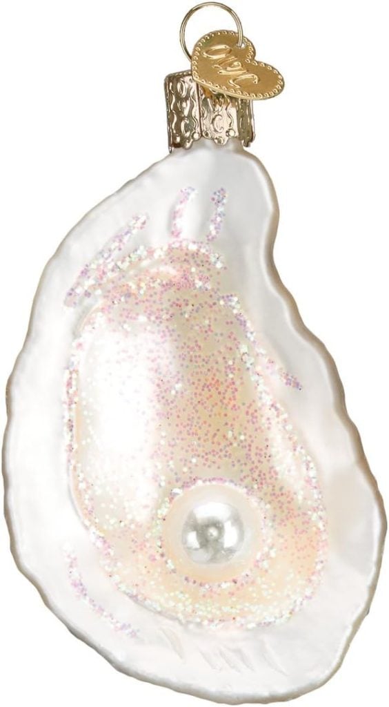 An oyster shell ornament with a metallic finish, showcasing a pearl at its center and a delicate gold heart perched gracefully on top.