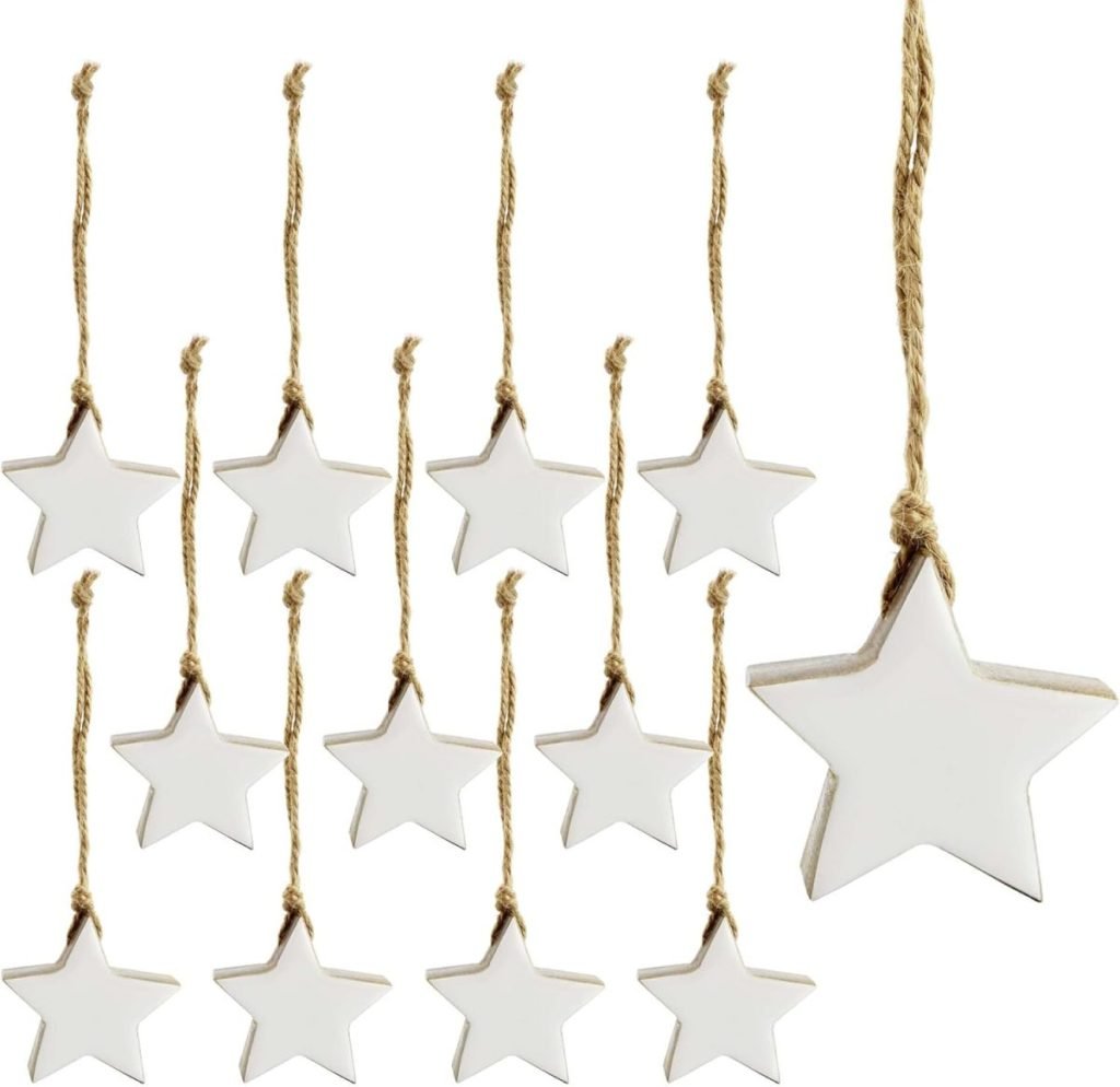 Twelve white star-shaped ornaments with jute twine loops, subtly accented in Christmas colors, are arranged in two rows.