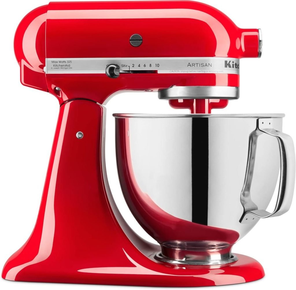 A red standing mixer with a stainless steel mixing bowl and control dial on the side is perfect for crafting holiday desserts.