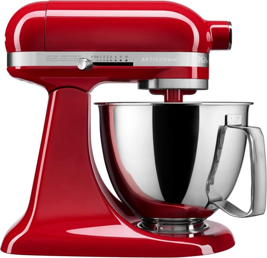 This red stand mixer, adorned in festive Christmas colors, features a stainless steel bowl and a side dial with various speed settings.