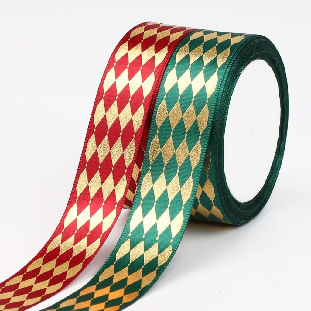 Two rolls of ribbon, perfect for gift wrapping, one red and gold, the other green and gold, featuring a diamond pattern, are displayed side by side against a white background.