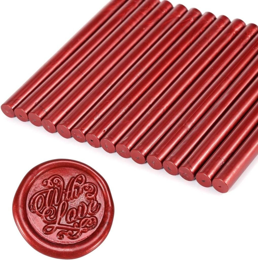 Red wax sticks lined up, with a round wax seal impression featuring the words "With Love" displayed below—perfect for adding a personal touch to your gift wrapping.