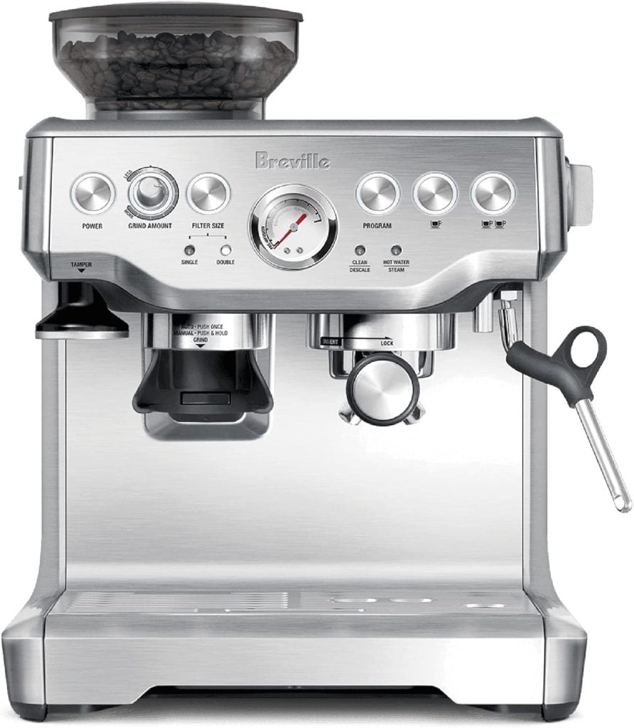 Silver espresso machine with a built-in grinder and steam wand, featuring various control knobs and a digital display.