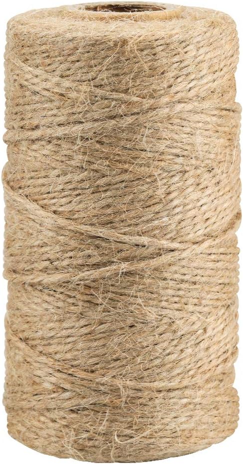 A large roll of natural jute twine, ideal for button crafts, tightly wound and standing upright.