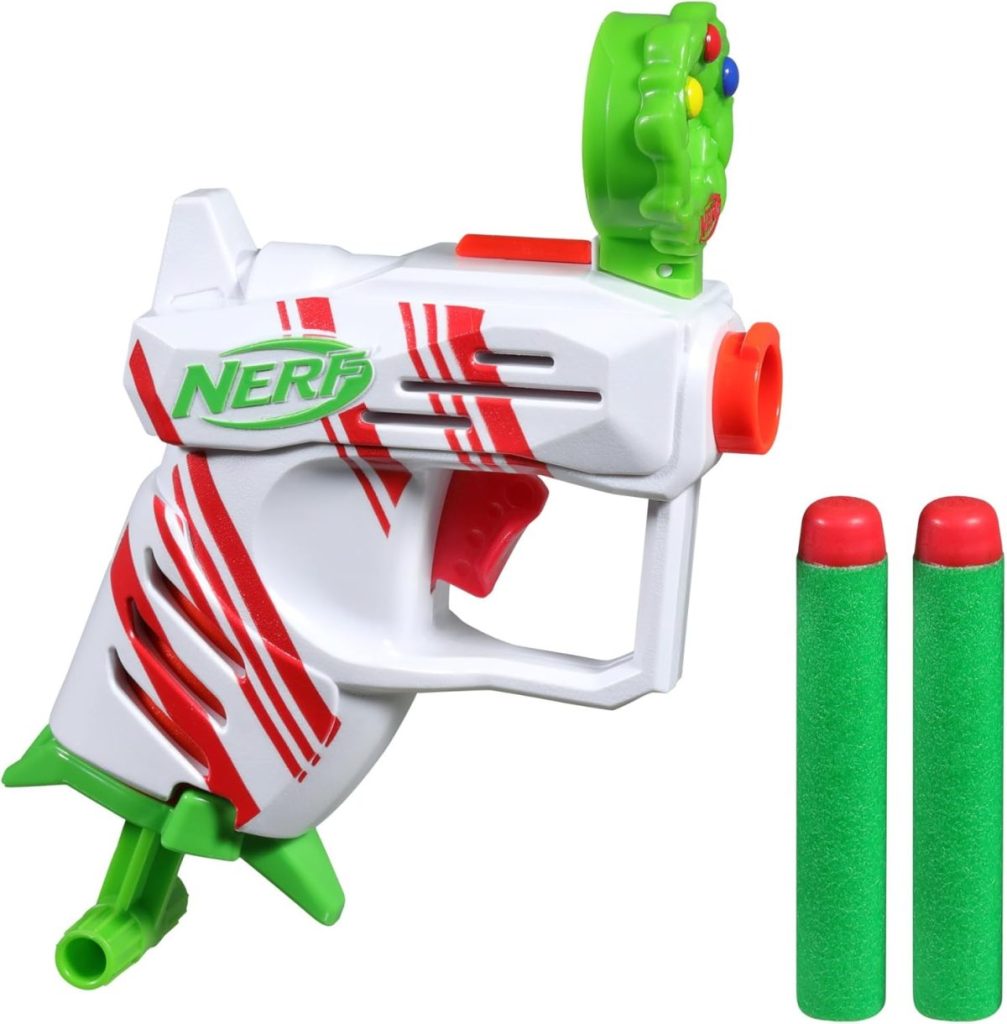 A white and red Nerf toy blaster with a green alien-themed detail, shown with two green foam darts—perfect for adding excitement to Christmas Morning.