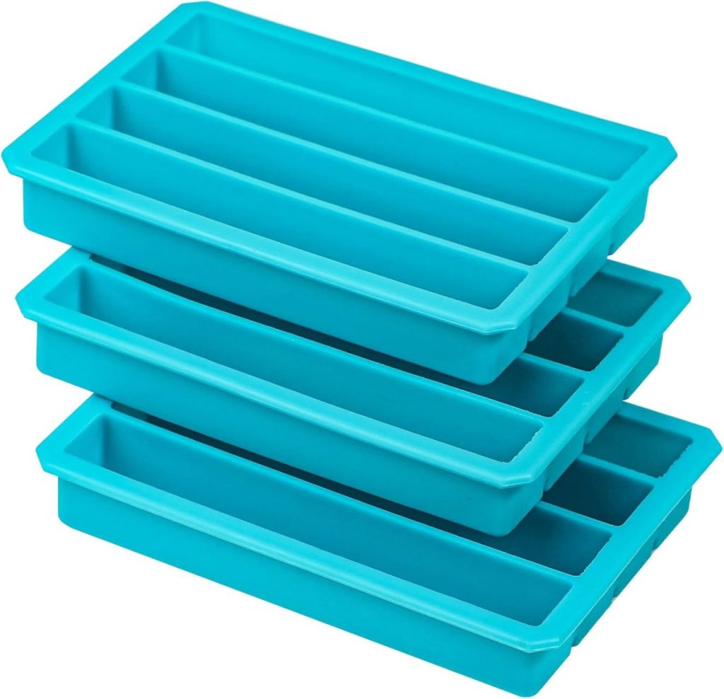 Three stacked blue silicone ice cube trays with narrow rectangular compartments, perfect for chilling drinks during cherished family traditions.