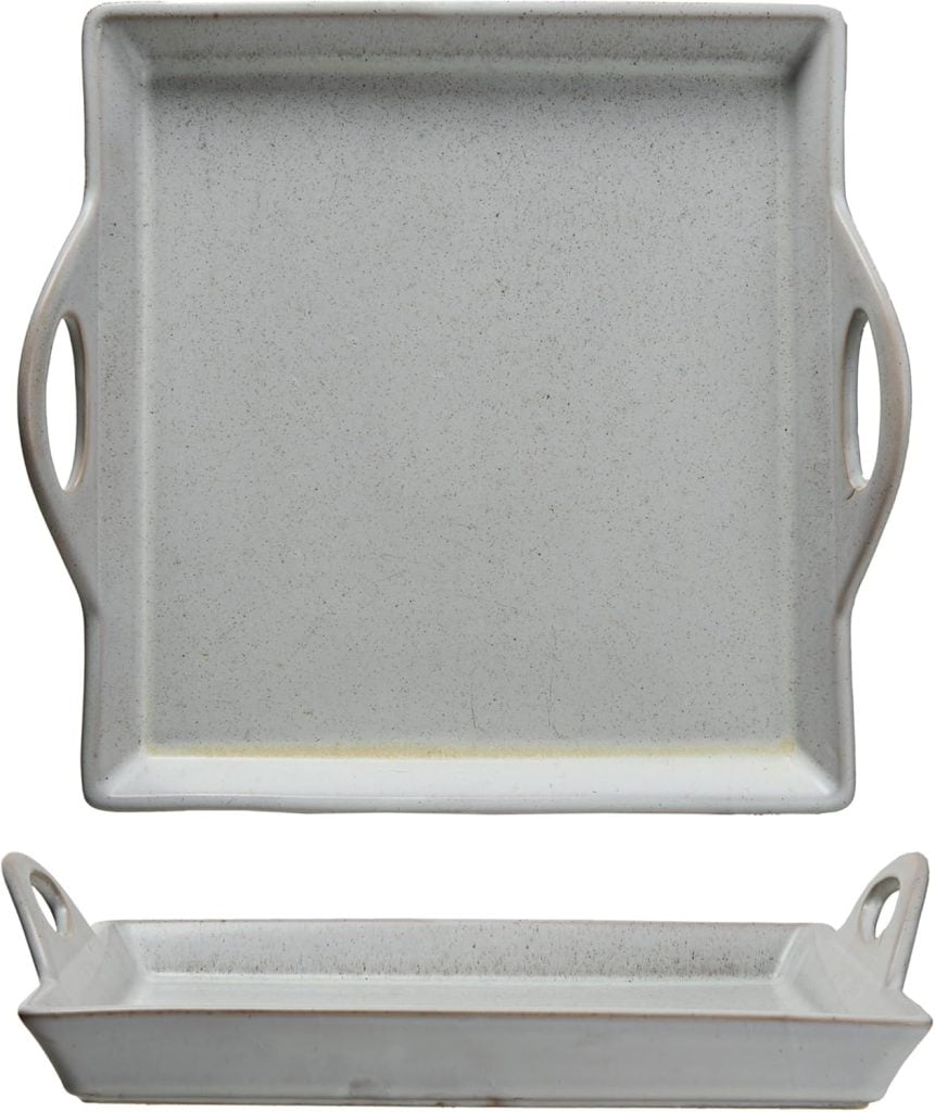 Rectangular ceramic tray with two handles, shown from top and side views. The light gray, minimalist design is perfect for serving cocktails like a vodka cranberry or elegant appetizers at your next gathering.
