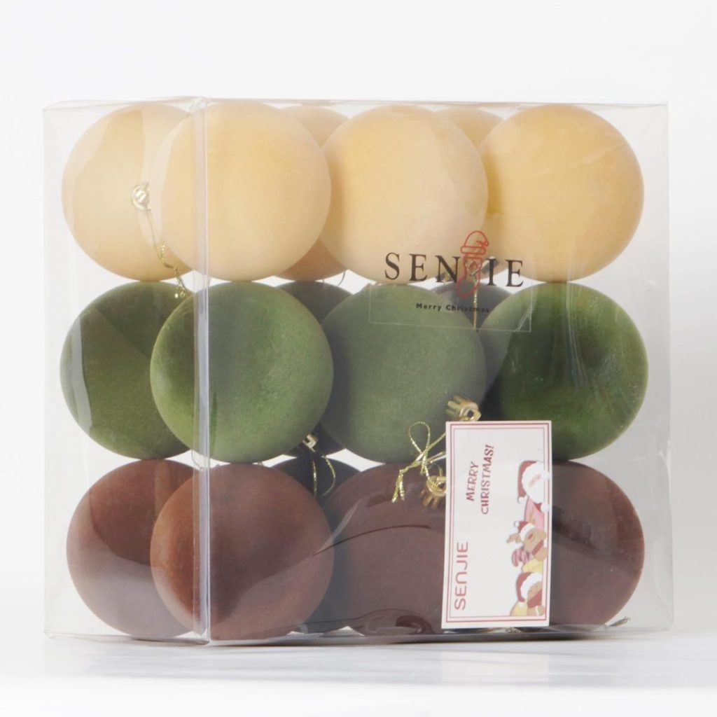 A clear box contains three rows of round ornaments in beige, green, and brown with gold hanging loops. A label on the box reads "SENUE Merry Christmas." Perfect for Black Friday holiday decorating deals.