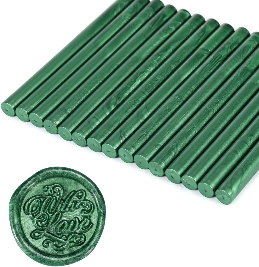 Seventeen green metallic wax sticks are arranged side by side, perfect for gift wrapping. In the foreground, a green wax seal imprint reads "With Love," adding a touch of elegance and charm.