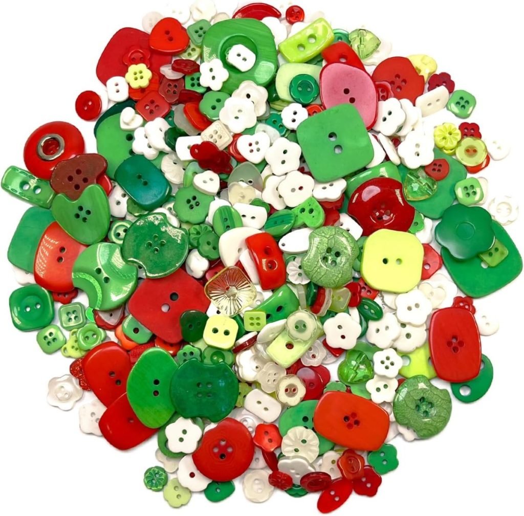 A colorful assortment of red, green, and white buttons in various shapes and sizes, perfect for button crafts, scattered in a delightful pile.