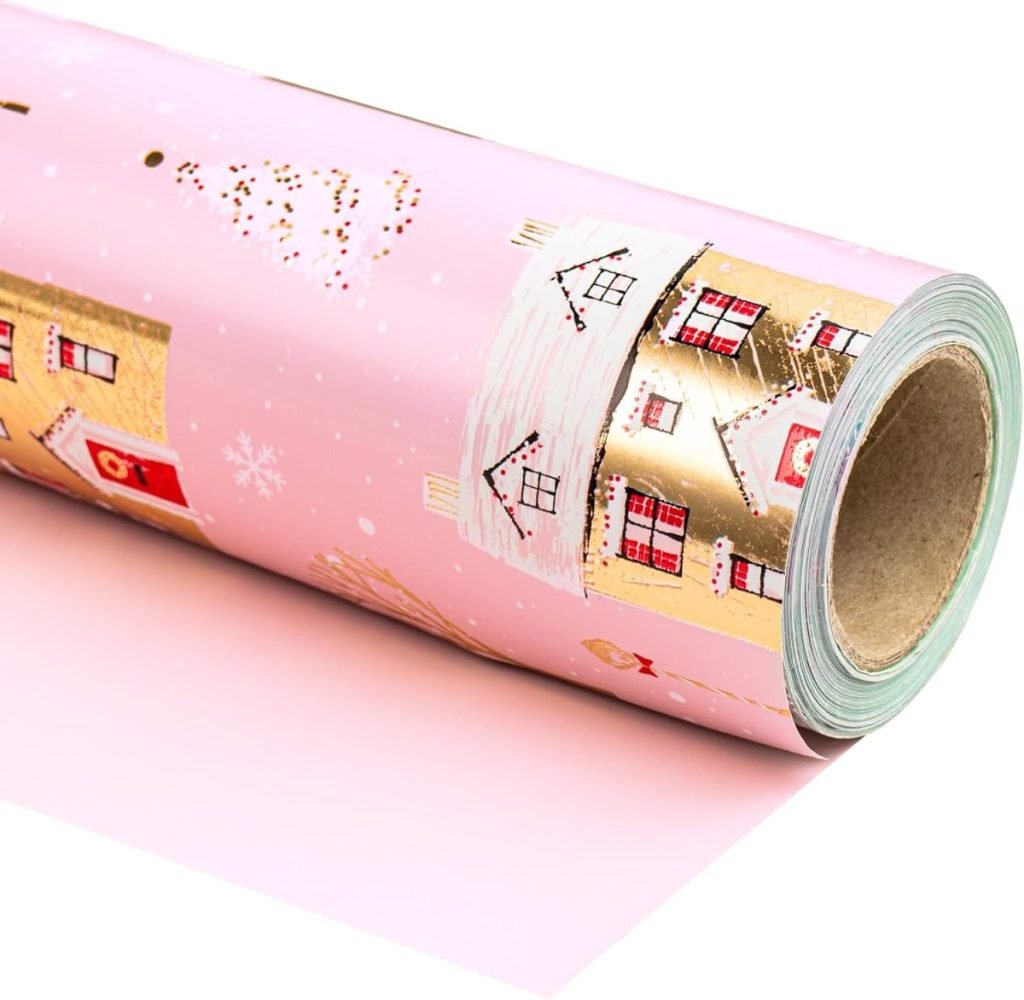 A roll of pink wrapping paper adorned with gold and red house designs, perfect for those special occasions. Pair it with a guide on how to tie a bow to add a touch of elegance to your gift.