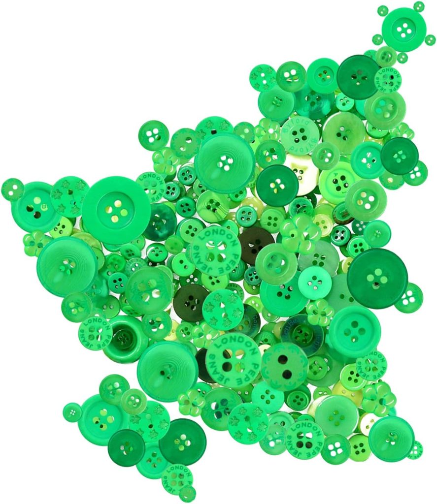 A cluster of various sizes of green buttons is artfully arranged in a loose shape on a white background, showcasing the charm of button crafts.