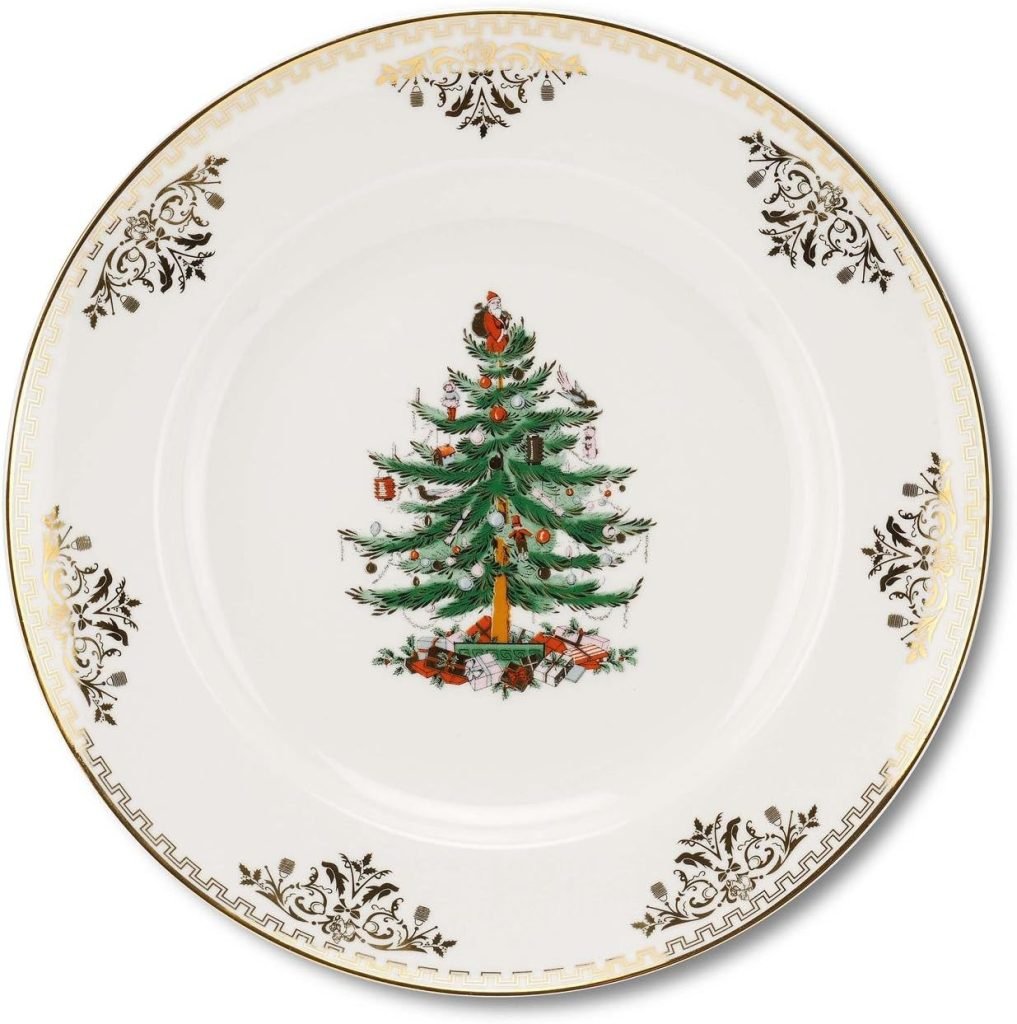 White plate with ornate gold patterns, featuring a central design of a decorated Christmas tree wrapped in a festive Christmas ribbon.