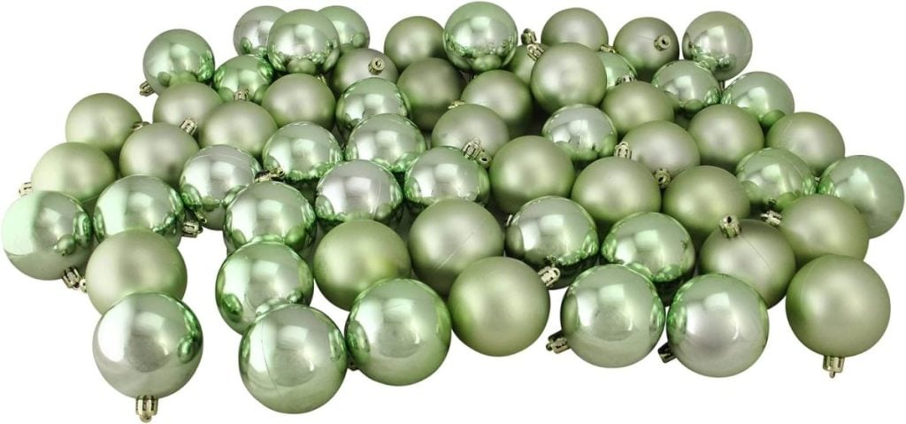 A collection of green Christmas ornaments piled together.