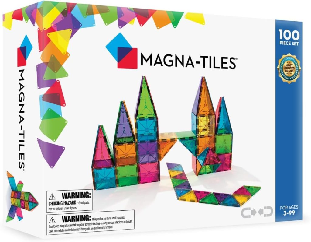 Box of Magna-Tiles 100-piece set, showing colorful magnetic building tiles arranged in towers and geometric shapes; perfect for ages 3–99—ideal for Black Friday deals.