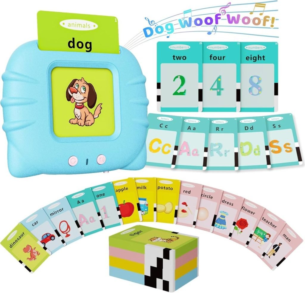 A children's educational device, perfect for Black Friday deals, comes with cards to learn numbers, letters, and words. It showcases a dog illustration and the word "dog" on a screen, surrounded by various learning cards.