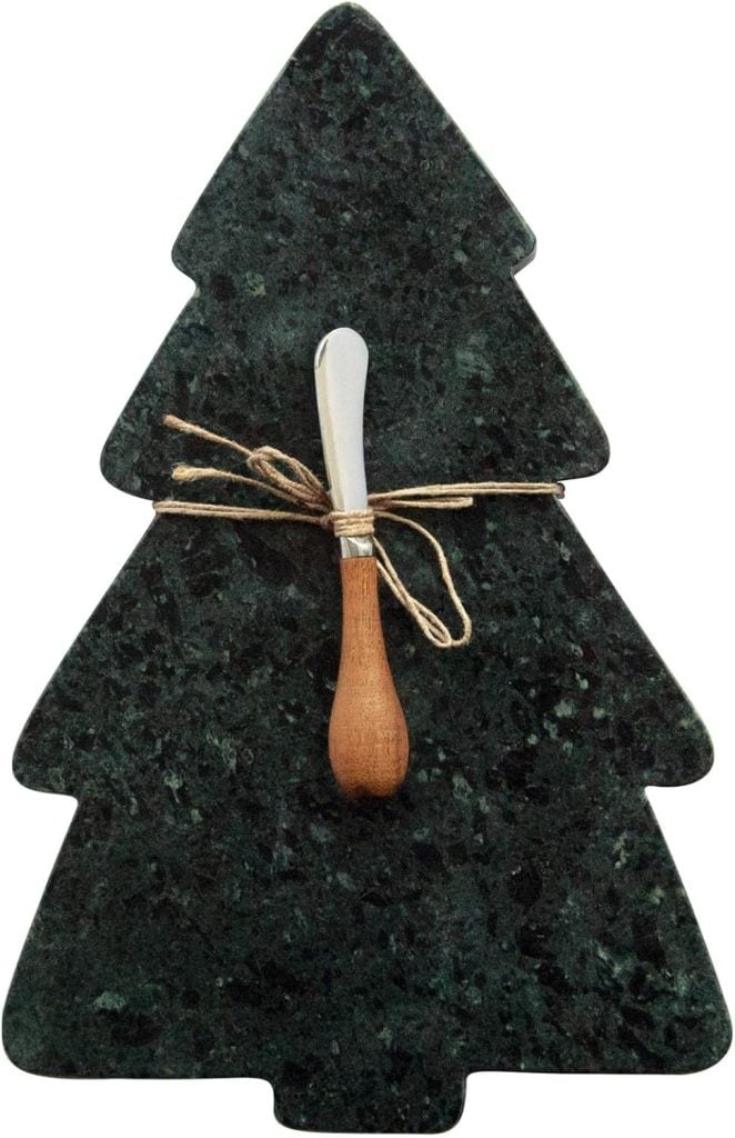 A dark green marble cheese board shaped like a Christmas tree, with a small cheese spreader tied to it using twine—perfect for serving cheeses or classic Christmas cookies at your holiday gatherings.