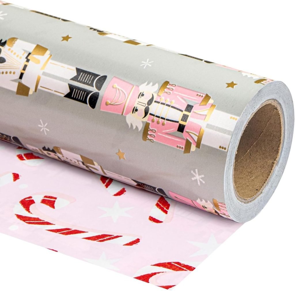 A roll of gift wrapping paper showcasing nutcracker designs on the outer layer and candy cane patterns on the inner layer.