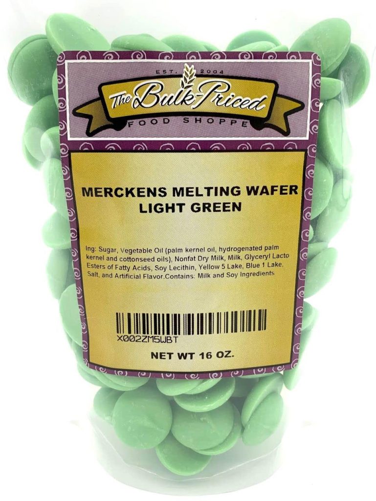 A bag of Merckens light green melting wafers, 16 oz, perfect for creating festive treats like Christmas tree cupcakes. The ingredients and branding are clearly displayed on the label for your convenience.