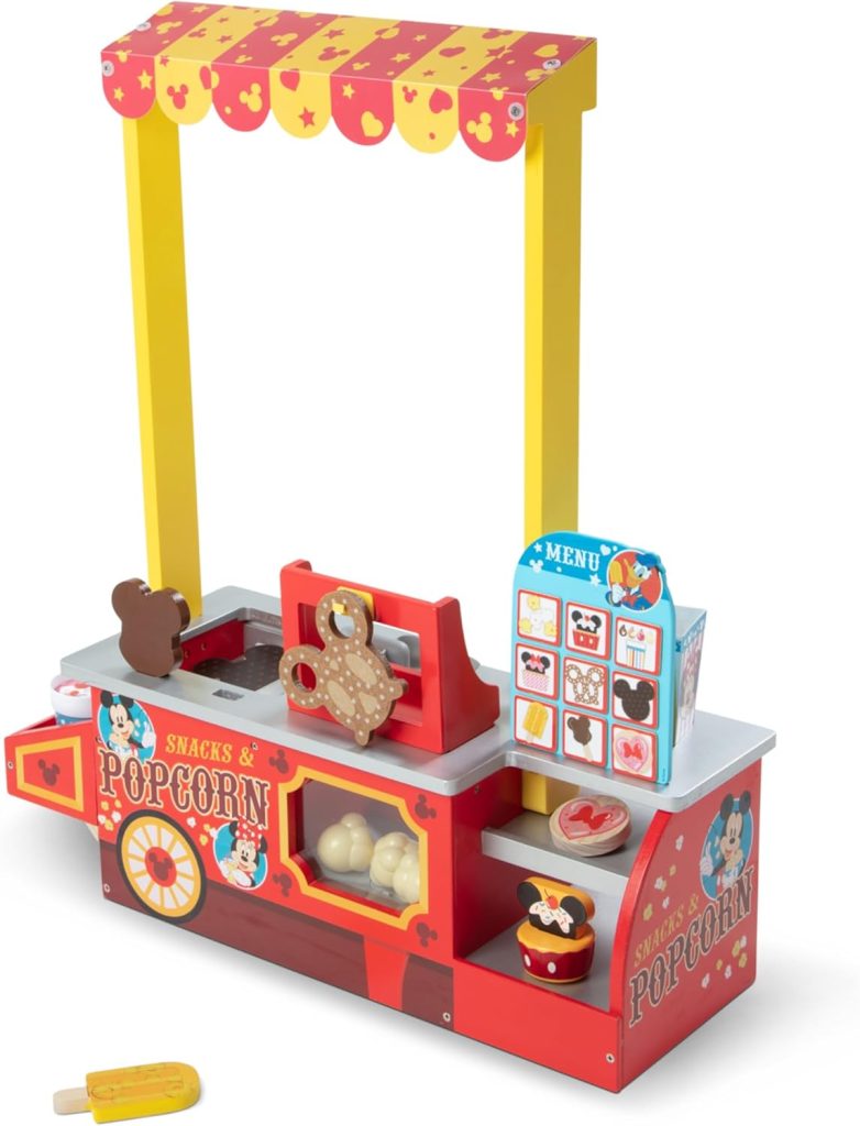 A colorful toy popcorn and snack stand set with pretend snacks, cash register, menu board, and decorative graphics—perfect for Black Friday gift shopping.
