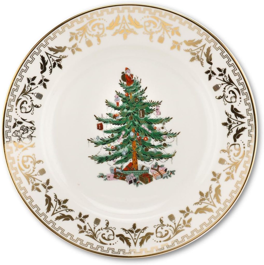 A decorative plate featuring a Christmas tree design complemented by a gold ornamental border is perfect for serving festive treats like Christmas tree cupcakes.