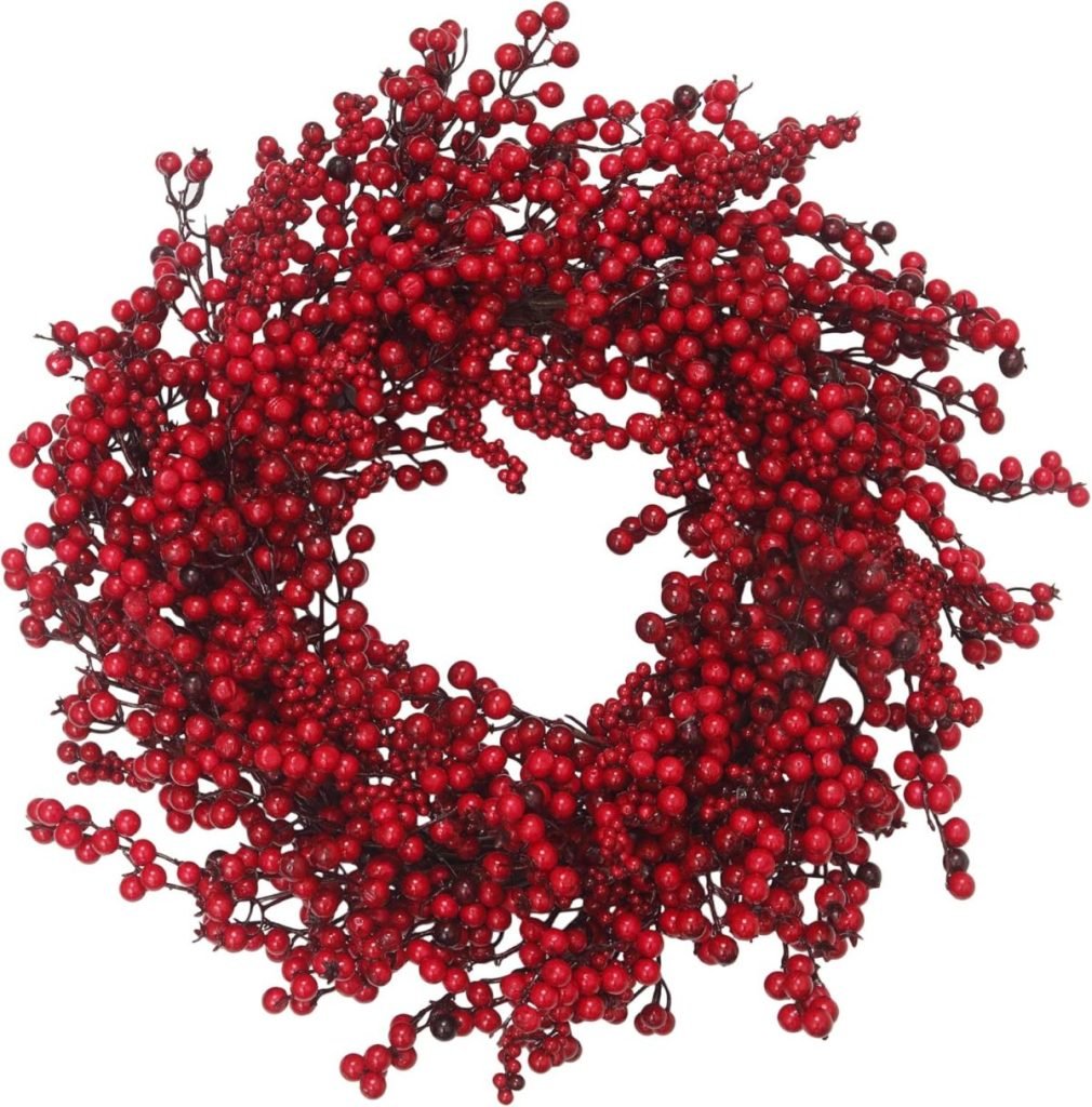 A festive Christmas wreath crafted from dense, vibrant red berries.