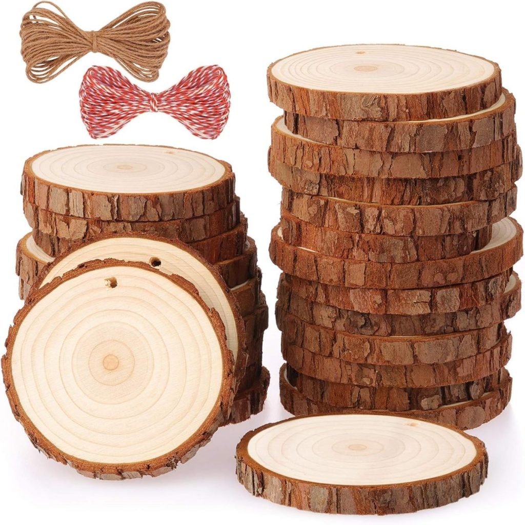 Stacks of wooden slices with holes, alongside two bundles of twine in brown and red-white colors.