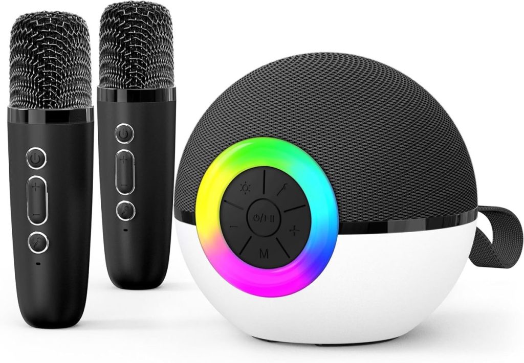 Two black wireless microphones and a round black-and-white Bluetooth speaker with a rainbow LED ring and control buttons are shown—perfect for Black Friday deals.