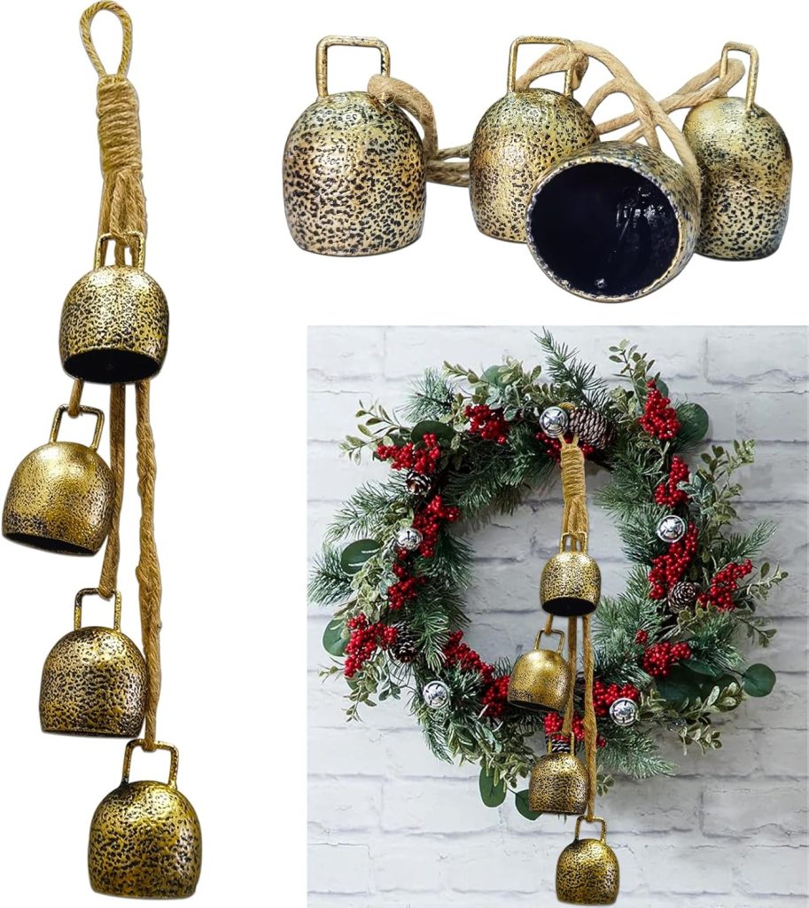 A set of four rustic metal bells on a rope is shown both alone and hanging from a wreath with greenery and red berries—perfect for adding festive charm to your décor this Black Friday.