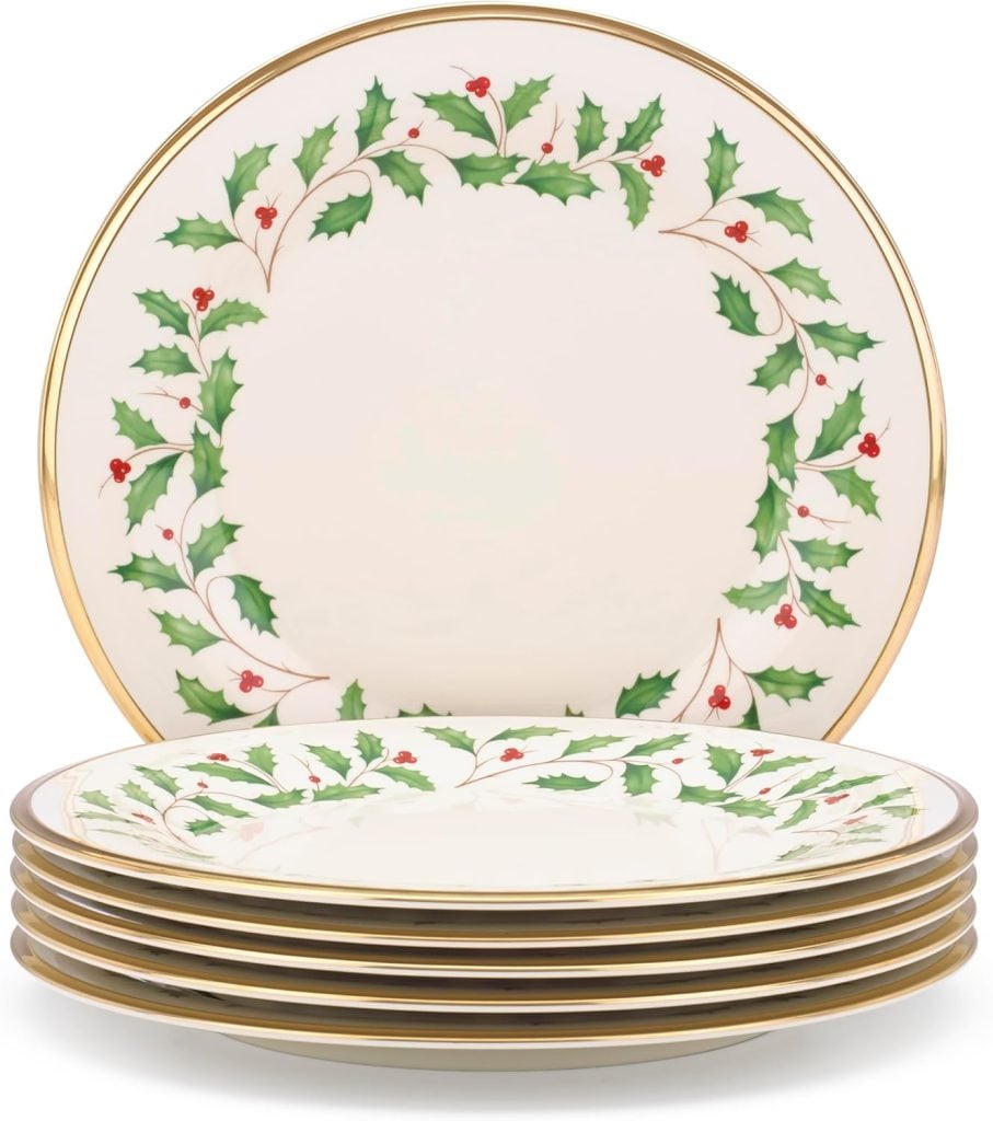 A festive stack of six plates with gold trim featuring a holly and berries design, perfect for adding a touch of elegance to your Nutcracker Christmas celebration.