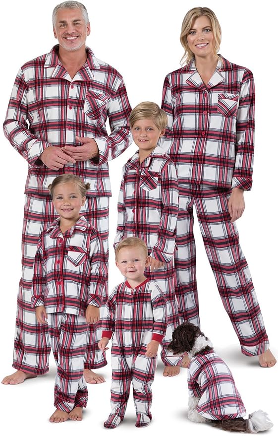 The family, clad in matching red and white plaid pajamas, beams with joy alongside their dog on an unforgettable Black Friday morning.