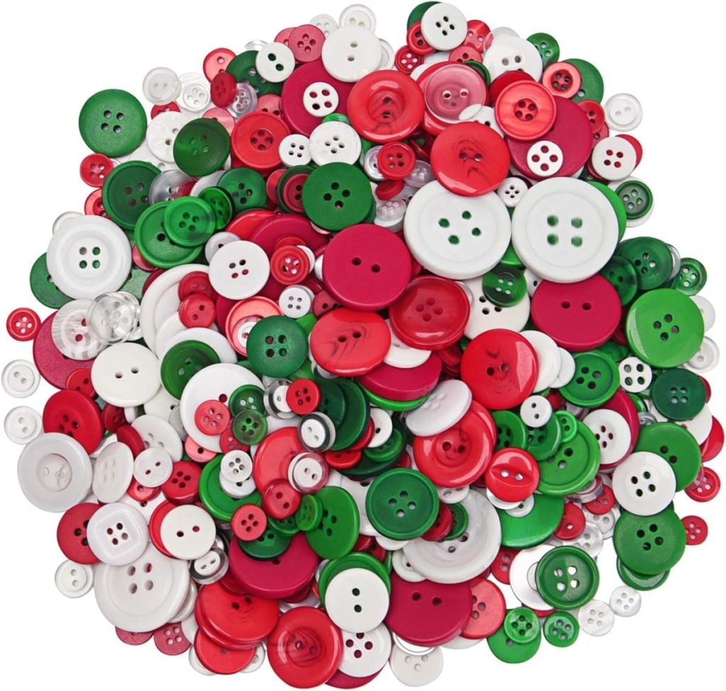 A vibrant collection of green, red, and white buttons in assorted shapes and sizes, perfect for button crafts.