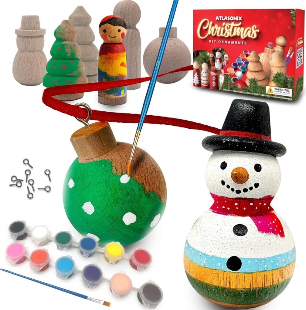 Create lasting family traditions with this DIY Christmas ornament kit, featuring unpainted wooden figures, a paint set, brushes, and a red string. Painted examples include a charming snowman and a festive green ornament embellished with snowflakes.