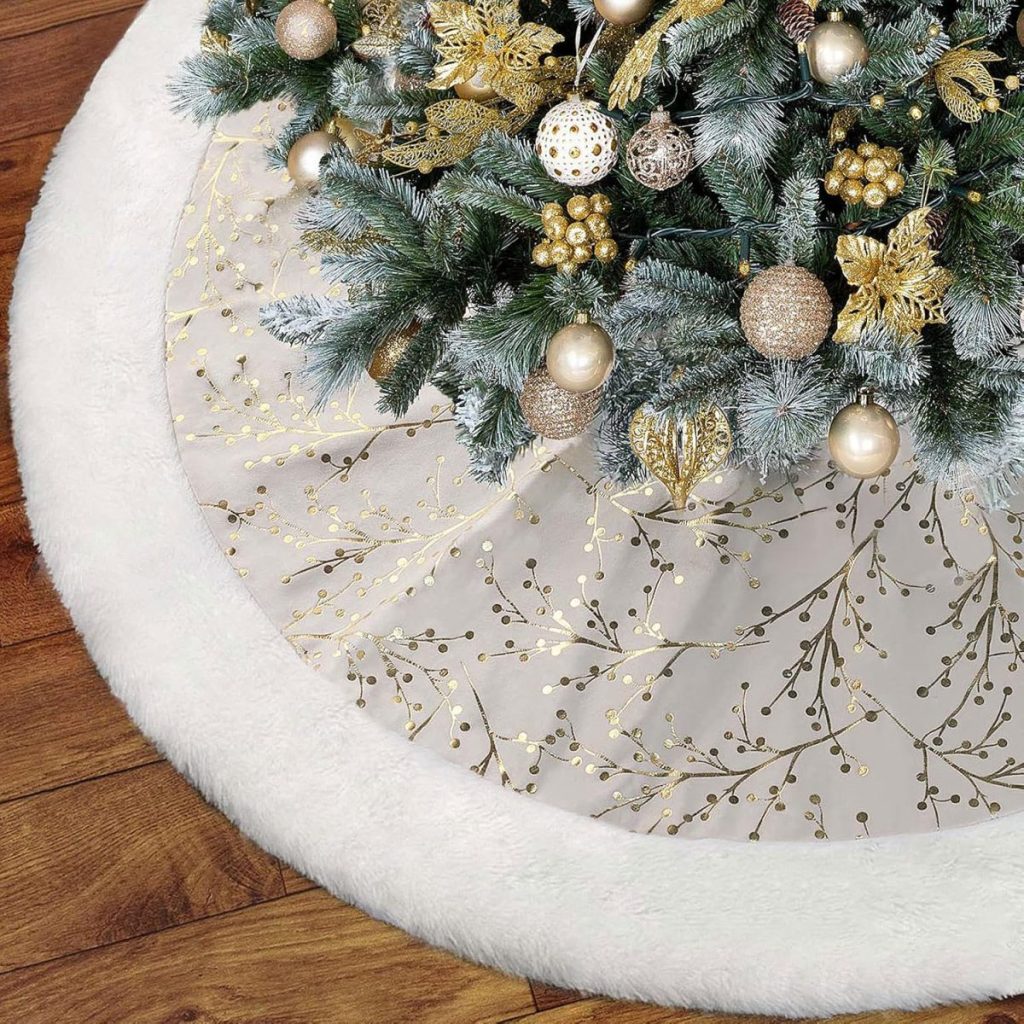 Close-up of a beautifully decorated Christmas tree featuring gold and white ornaments, elegantly perched on a christmas tree skirt with a white and gold pattern, all set against the charm of a wooden floor.