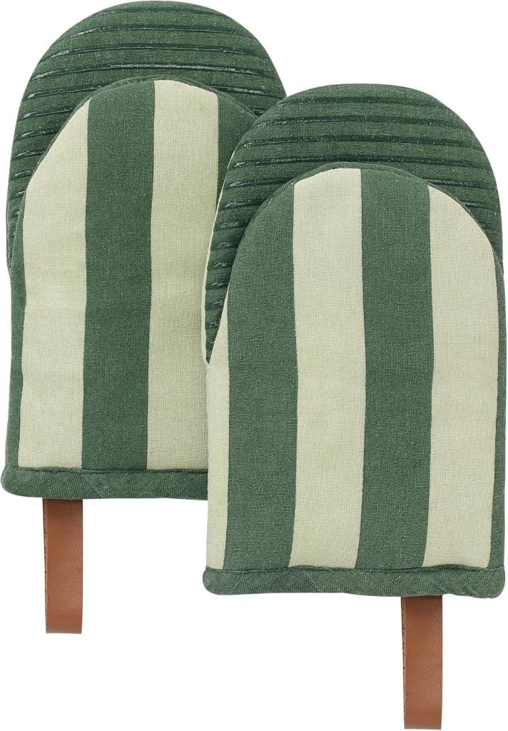 A pair of green and beige striped oven mitts with brown hanging loops, perfect for bringing Christmas Morning warmth to your kitchen.