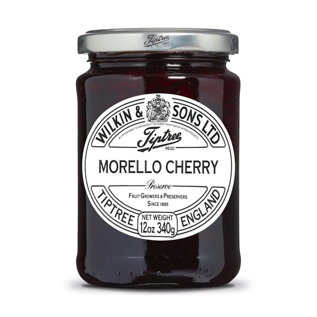 A jar of Tiptree Morello Cherry preserve by Wilkin & Sons Ltd. The label shows a net weight of 12 oz or 340 grams.