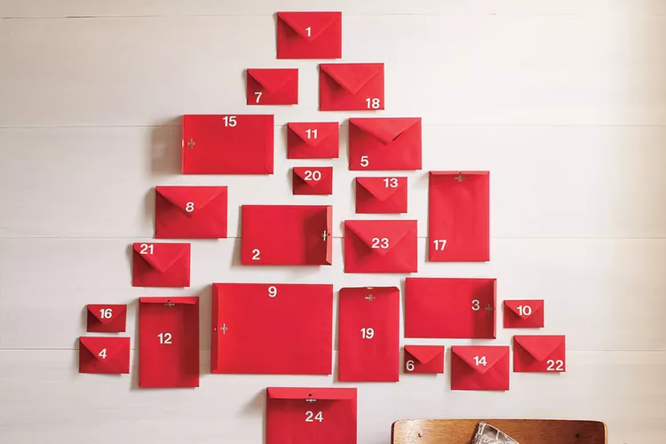 A wall display features 24 red envelopes, resembling a Christmas tree, each adorned like a piece of fine gift wrapping and numbered with care.